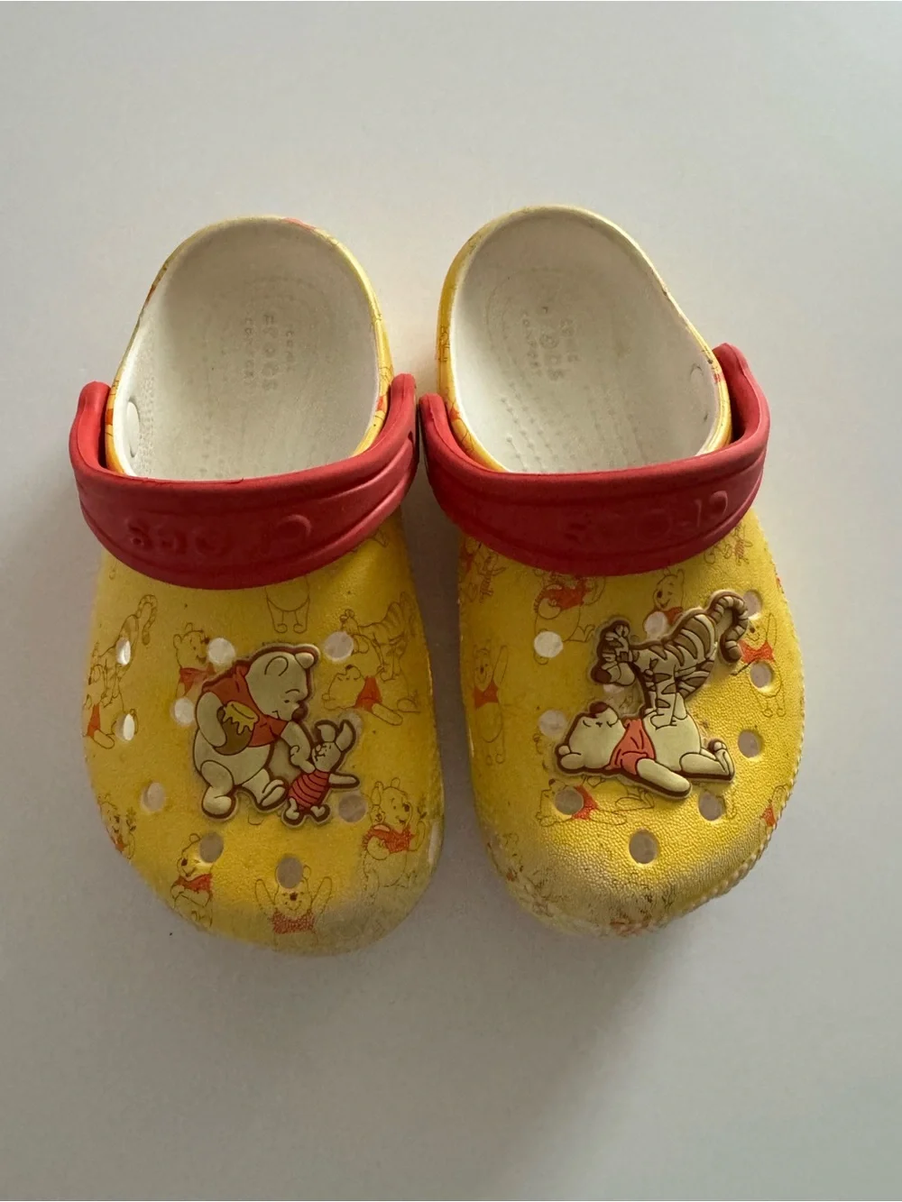 CROCS Kids Yellow Clogs with Red Heel Straps - Winnie the Pooh Theme